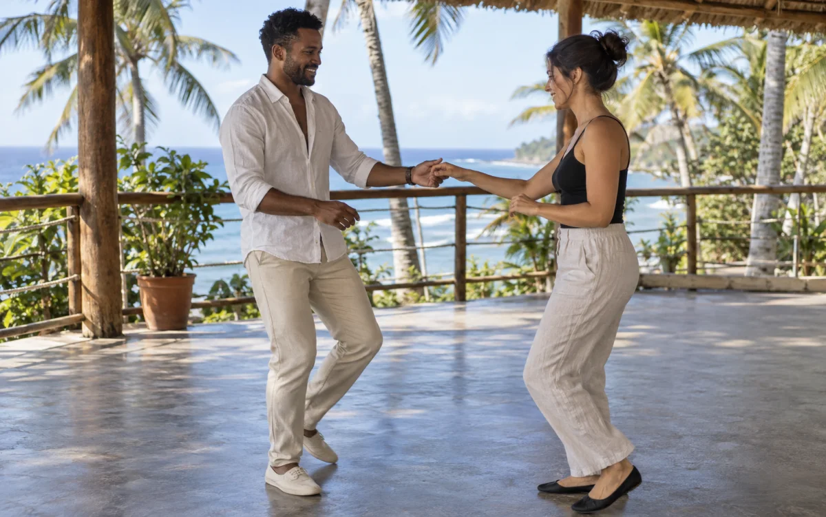 Illustration: Instructor and student practicing bachata on a seaside terrace