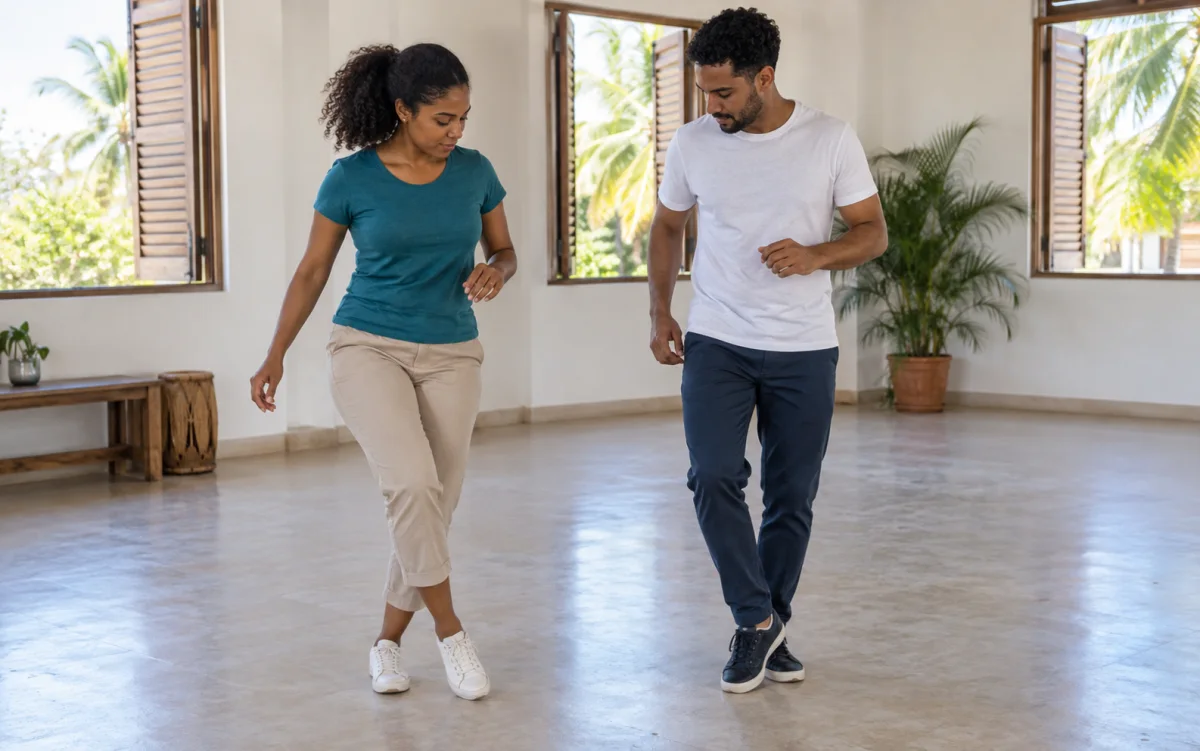 Ilustración: Instructora y alumno practicando pasos básicos de bachata