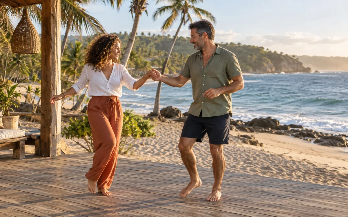 Illustration: Couple practicing bachata on a beach terrace in late afternoon